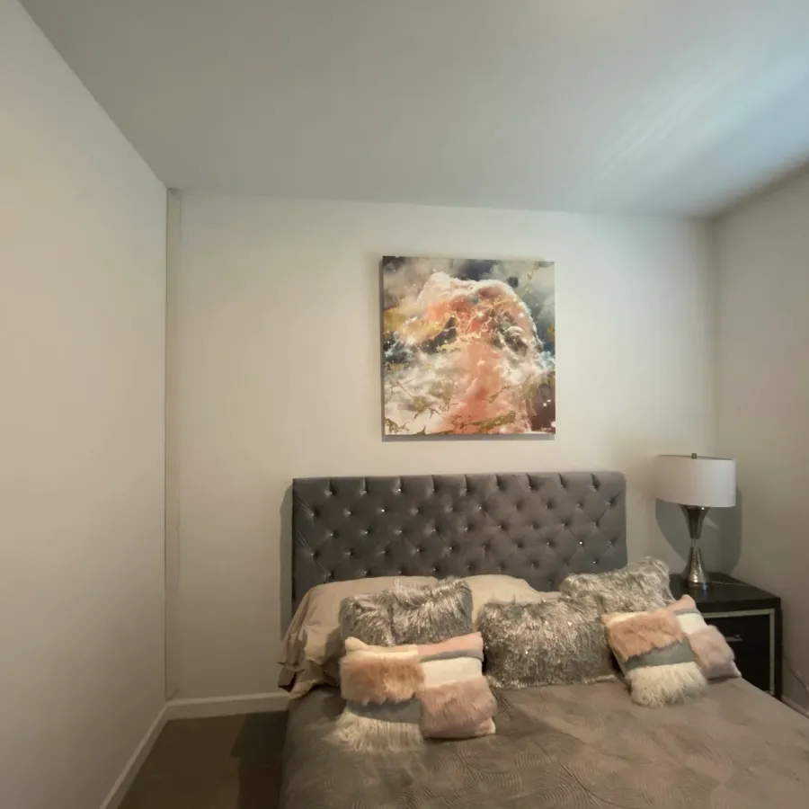 A bedroom freshly painted in a warm greige