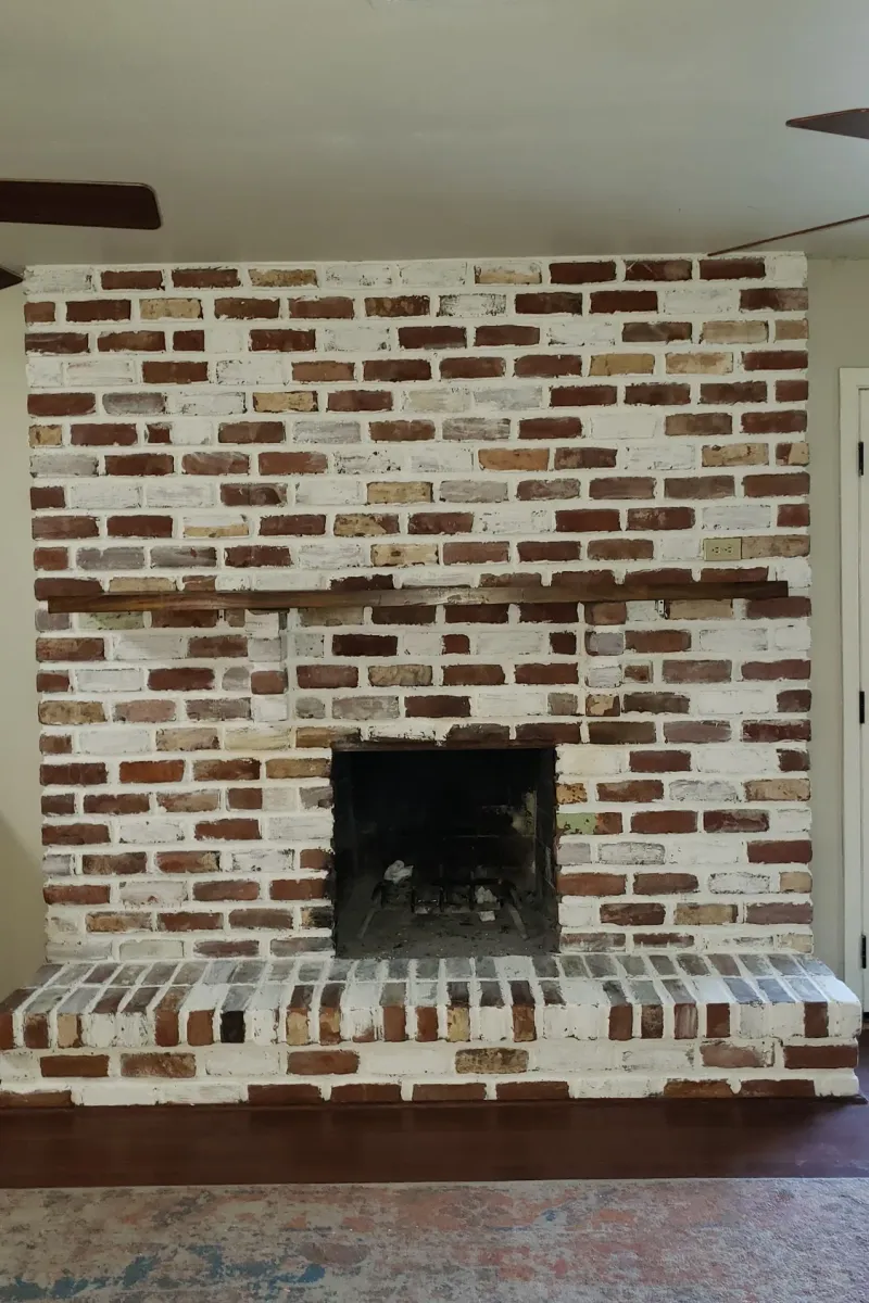 The same fireplace with a white German schmear over the brick