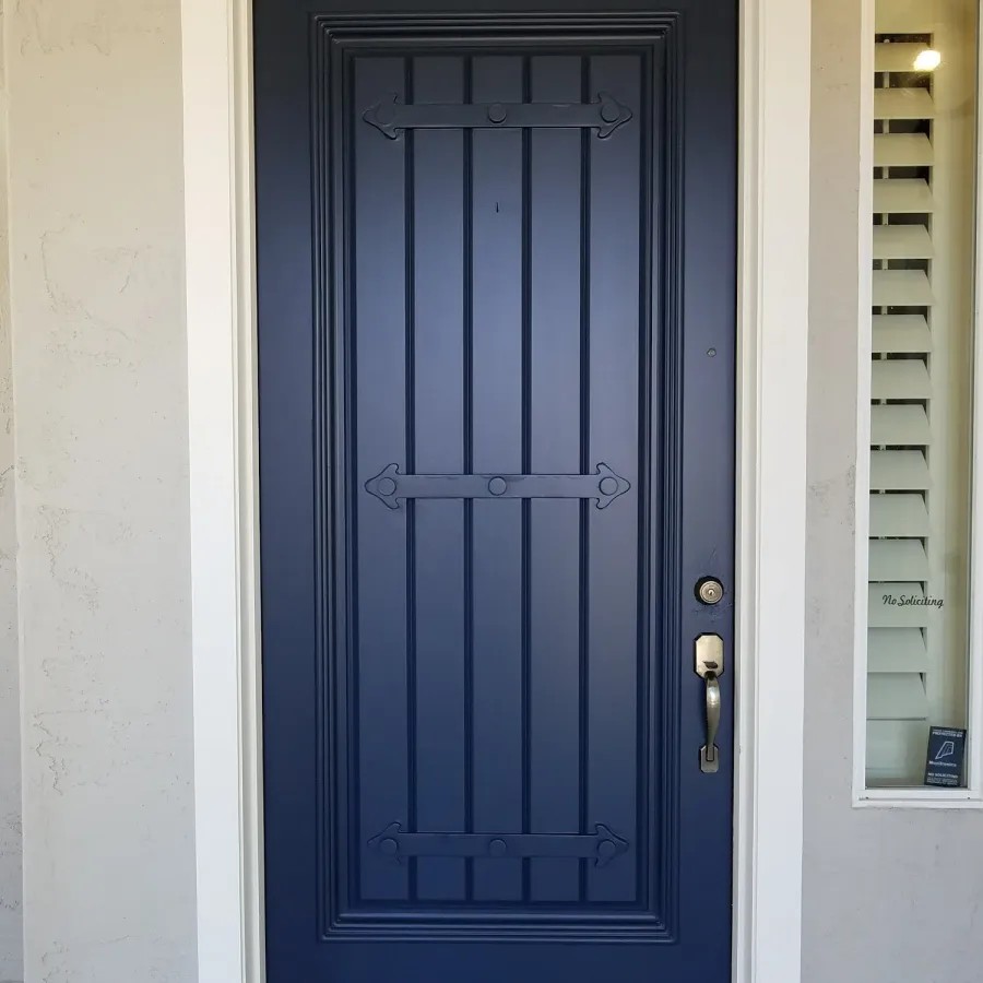 A front door painted deep navy blue