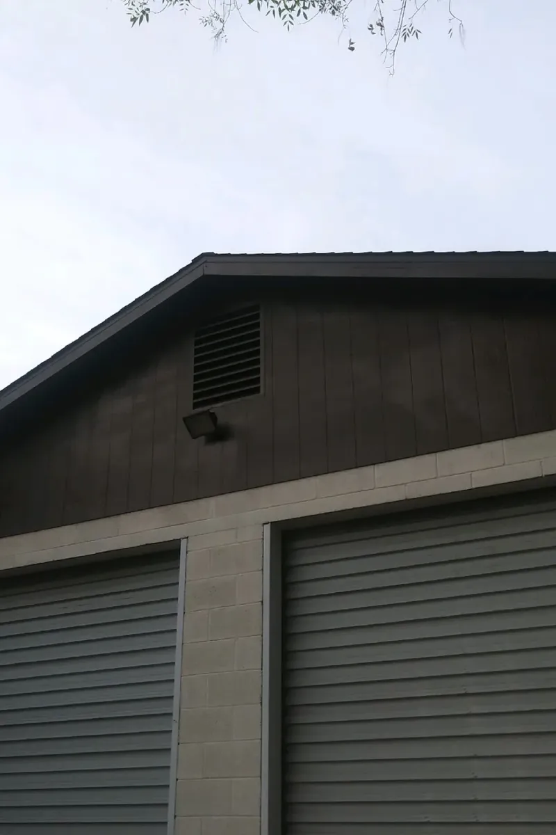 The same garage repainted in dark grey