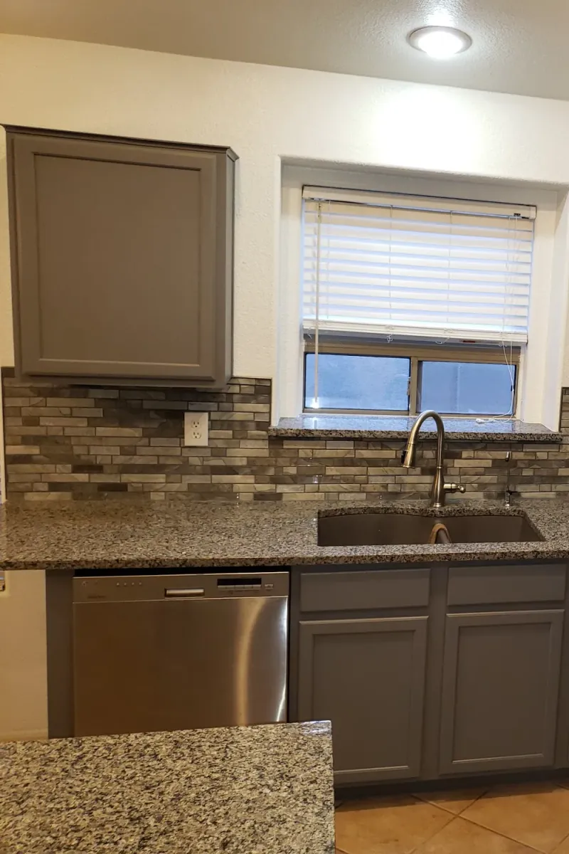 The same kitchen with its cabinets painted grey