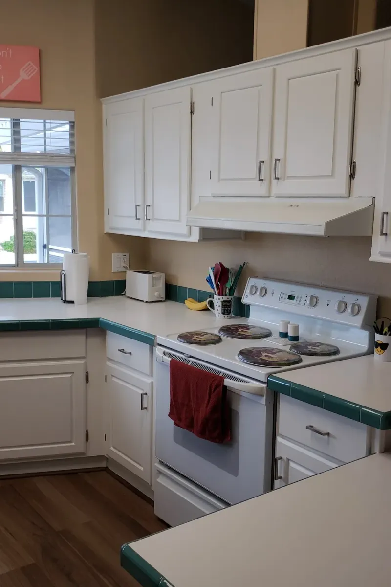 The same kitchen cabinets painted white