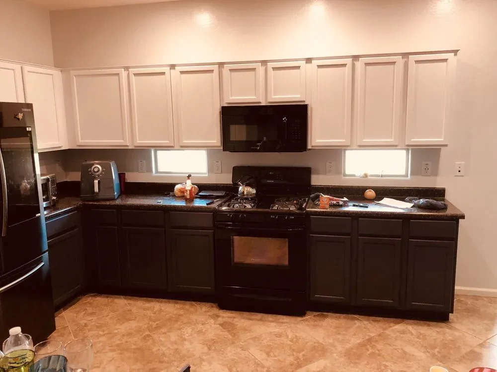 Two-tone kitchen cabinets with white uppers and charcoal lowers in an Arizona home